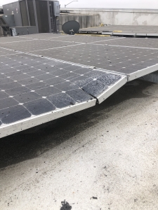 The edge of a solar panel breaking apart